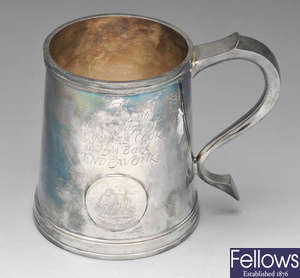 A modern silver commemorative mug.