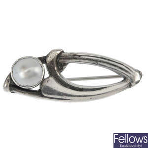 An early 20th century silver blister pearl brooch.