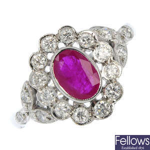 A ruby and diamond floral cluster ring.
