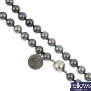 A Tahitian cultured pearl single-row necklace and ear pendants.