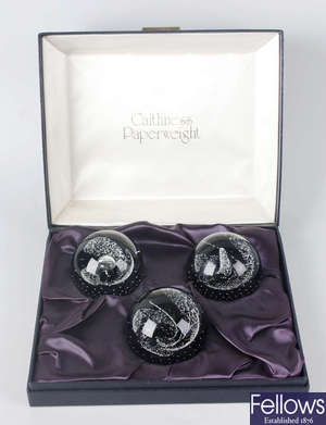 A cased set of three Caithness paperweights