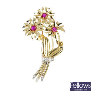 A ruby and diamond floral brooch.
