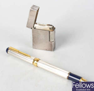 An S.T. Dupont silver plated lighter, plus a fountain pen