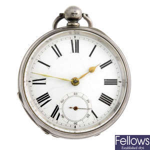 A silver open face pocket watch by Waltham and a white metal pocket watch.
