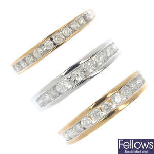A selection of three 9ct gold diamond half-circle eternity rings.
