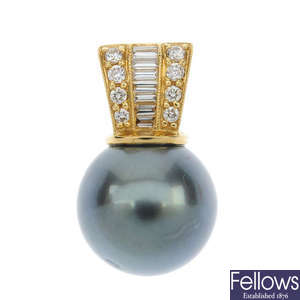 A stained cultured pearl and diamond pendant. 
