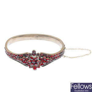 A late 19th century garnet and paste bangle.
