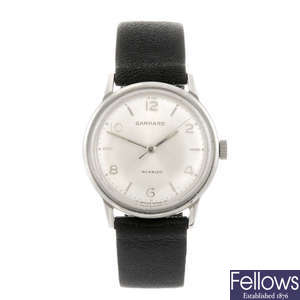 GARRARD - a gentleman's wrist watch together with three other watches.