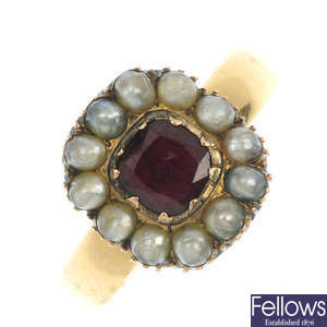 An early 20th century gold garnet and split pearl cluster ring.