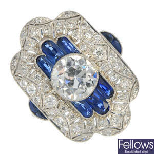 A mid 20th century diamond and sapphire panel ring.