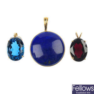 A selection of three gem-set pendants.
