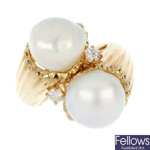 A 14ct gold cultured pearl and diamond crossover ring.