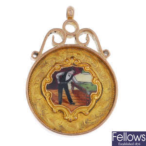 A 1930s 9ct gold enamel snooker or billiards medallion fob.