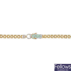 A 9ct gold diamond and emerald leopard bracelet.