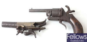 A 19th century revolver, plus another part pistol