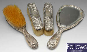 An Edwardian silver dressing table set and a vesta case.