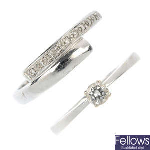 A diamond single-stone ring and a diamond crossover ring.