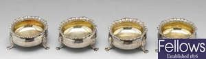 A set of four early 20th century silver open salts & a similar, later pair.