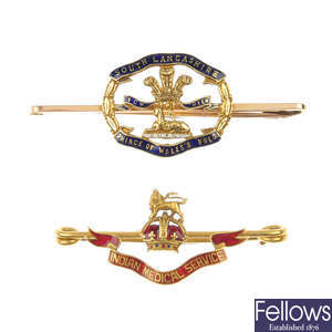Two early 20th century 15ct gold enamel Regimental brooches. 