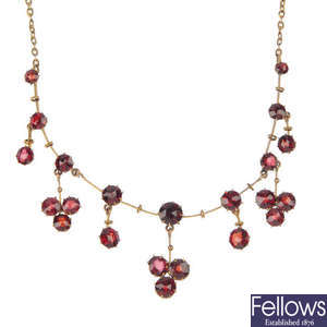 A late 19th century 9ct gold garnet necklace.