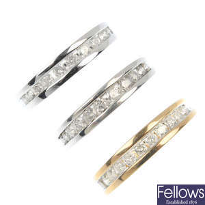 A selection of four 9ct gold diamond half-circle eternity rings.