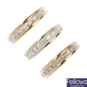 A selection of three 9ct gold diamond half-circle eternity rings.