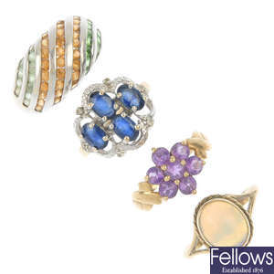 A selection of four 9ct gold gem-set rings. 