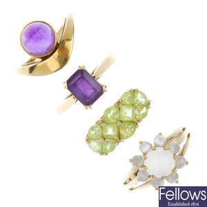 A selection of four gem-set dress rings.