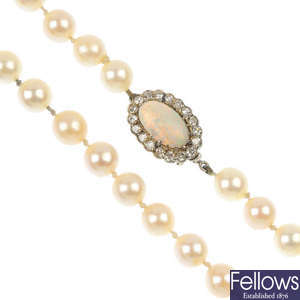 A mid 20th century cultured pearl single-strand necklace with opal and diamond cluster clasp.