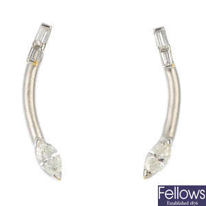 A pair of diamond ear pendants. 