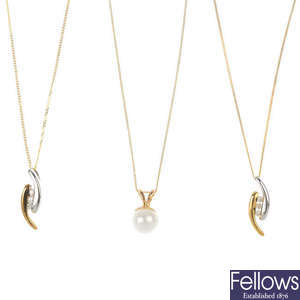 Twelve assorted cultured pearl and diamond pendants. 