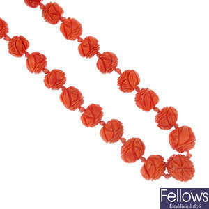 A late 19th century carved coral bead necklace.