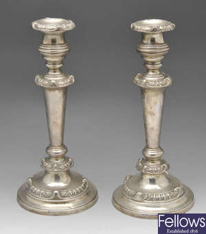 A pair of George III silver mounted candlesticks.