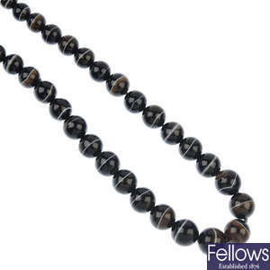 A banded agate single-strand bead necklace.