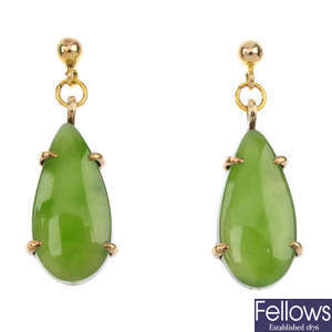 A pair of jade ear pendants and a jade pendant.