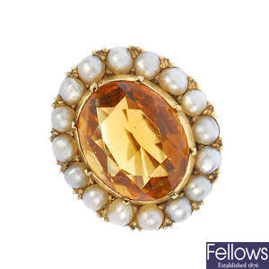 An early 20th century gold citrine and split pearl brooch.