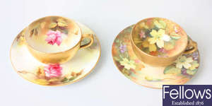 Two hand painted Royal Worcester cabinet cups and saucers