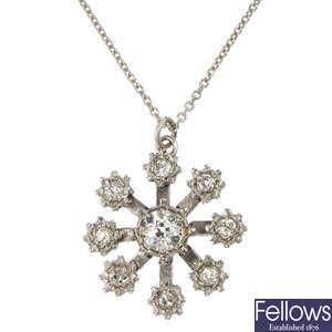 A diamond snowflake pendant.