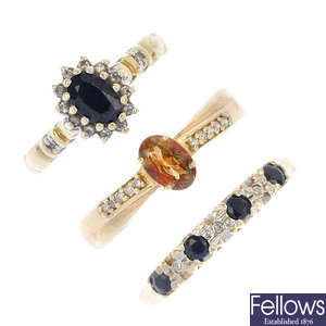 A selection of five gold diamond and gem-set rings.