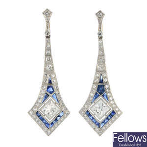 A pair of diamond and sapphire ear pendants.