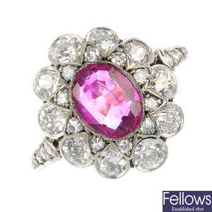 An early 20th century platinum and 18ct gold ruby and diamond cluster ring.