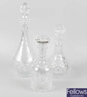 A group of glass decanters and candlesticks