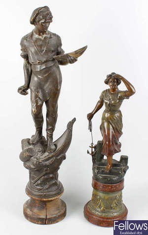 A box containing a large pair of spelter figurines