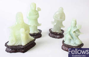 Four Chinese carved celadon jade figures 