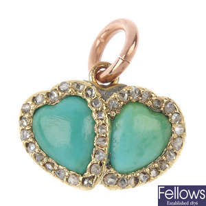 An early 20th century gold turquoise and diamond heart pendant.