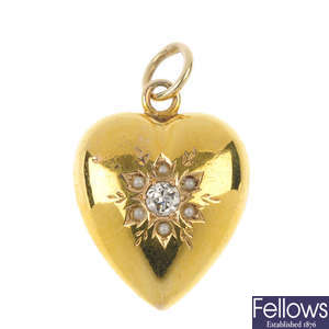 A late Victorian 15ct gold seed pearl and diamond heart pendant.