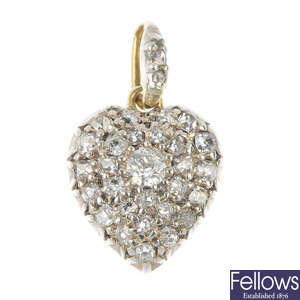 A late 19th century silver and gold diamond heart pendant. 