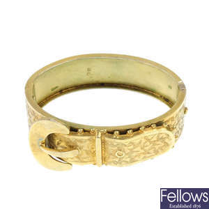 A late Victorian silver gilt hinged buckle bangle.
