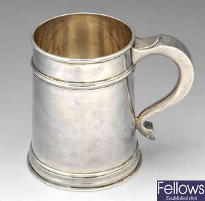 A 1930's silver mug.