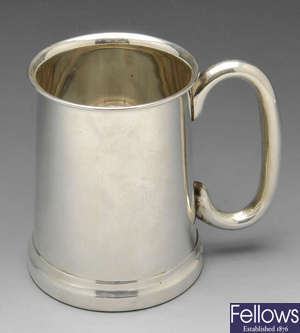 A 1930's silver mug.
